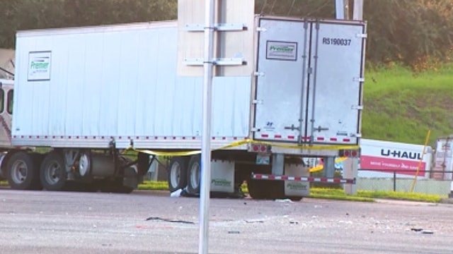 1 dead after car runs red light, hits tractor-trailer on OBT, FHP says