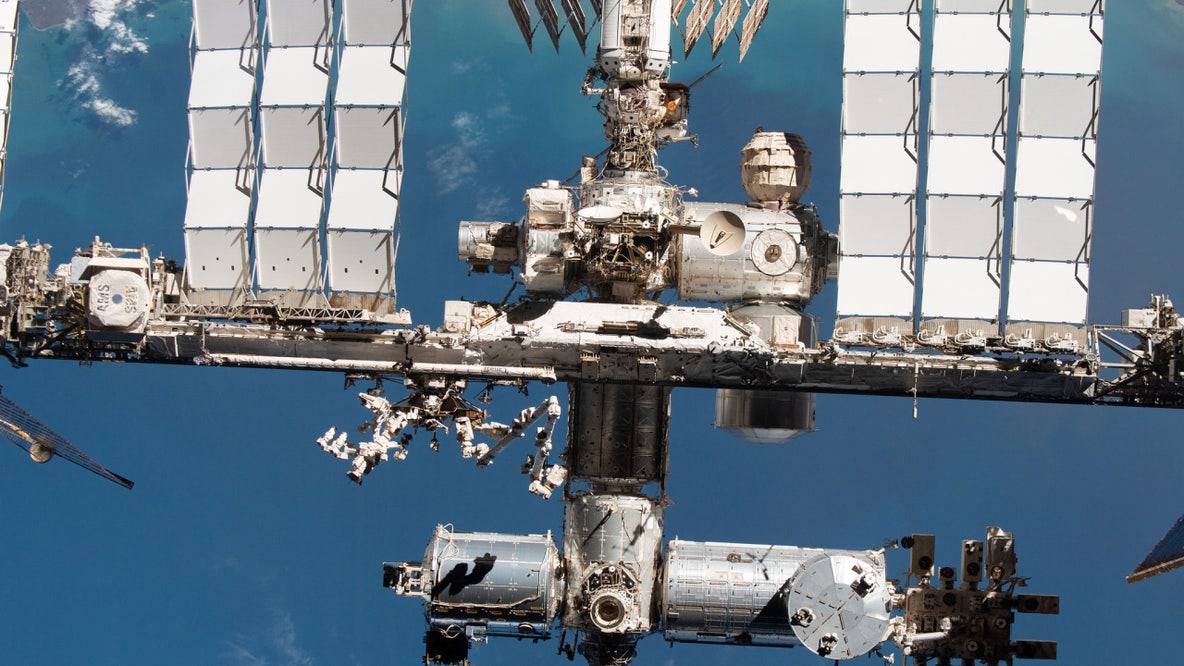NASA astronauts conduct spacewalk outside International Space Station