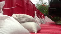 Florida woman flood proofs home with berm, pipes, pumps and portable barriers