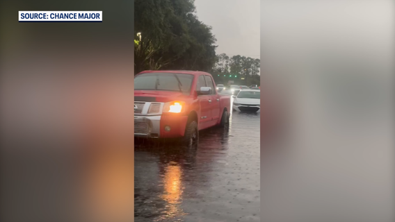 Best friends rescue drivers stranded in flooded Sanford intersection; county officials urge caution