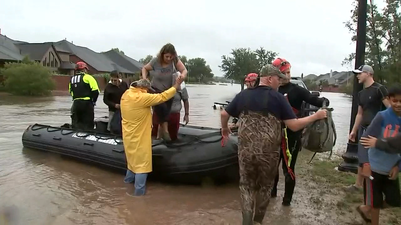 Crippled Houston watches dams, levees; forecast offers hope