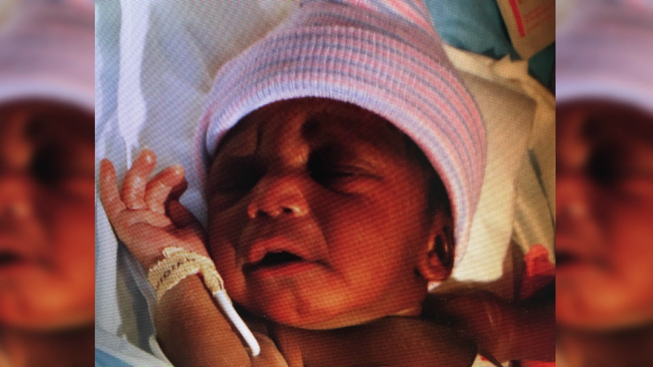Newborn baby found abandoned in suburban field