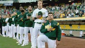 Maxwell kneels for anthem, Davis belts 40th as A's top Rangers