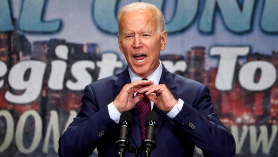 Biden defends past civil rights record after Harris attack