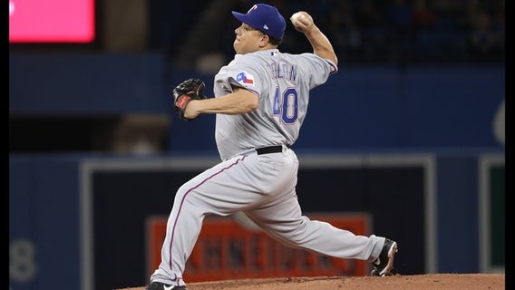 Almost 45, Colon pitches Texas over Toronto 7-4