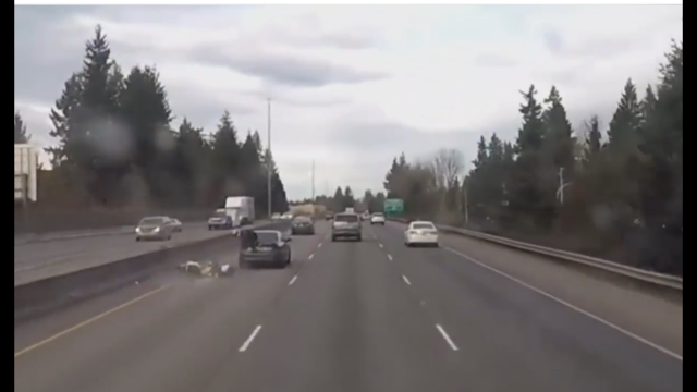 VIDEO: Motorcyclist runs into car trying to catch suspected drunk driver