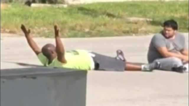 Police shoot autistic man's caretaker as he lies in street