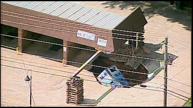Sinkhole swallows part of car wash in Athens