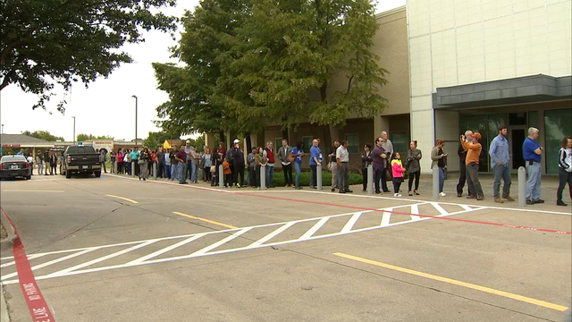 Voters pack the polls across the United States in a crucial test of Trump's tenure