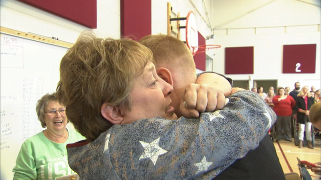 Dawson County teacher surprised by Marine son on Veterans Day