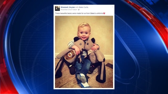 Son of slain officer receives teddy bears made from dad's uniform