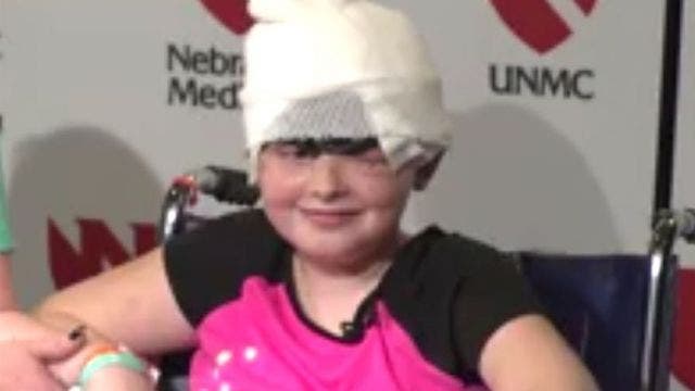 Girl who was scalped at carnival makes first public appearance