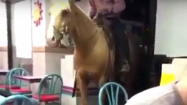 Man rides horse into North Texas Taco Bell