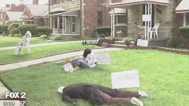 Woman makes statement with Halloween display of real life horrors