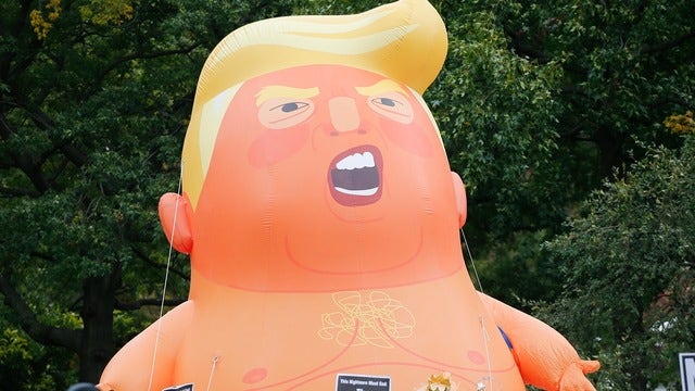 Trump supporter pops massive balloon depicting POTUS as baby at UK protests