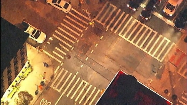 Suicide jumper lands on elderly woman