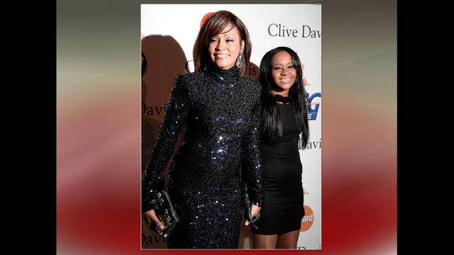 Bobby Brown tells concert goers his ailing daughter is awake