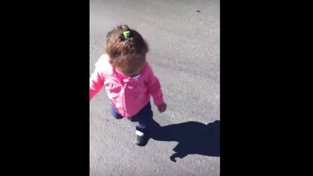 This little girl is adorably terrified of her own shadow