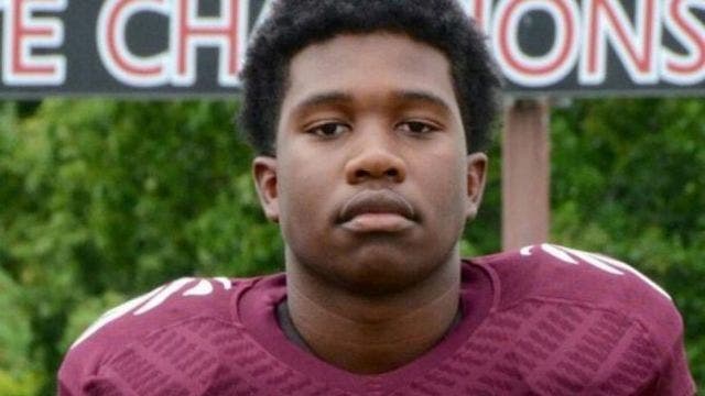 Football player killed shielding girls from gunfire, police say