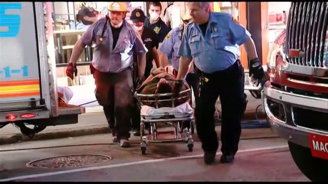 Student tries to impress woman jumping from rooftop to another, gets stuck between buildings instead