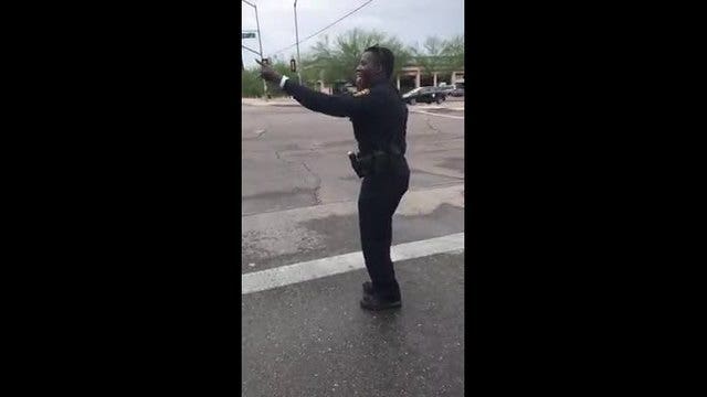 Dancing officer gets his groove on, directing traffic