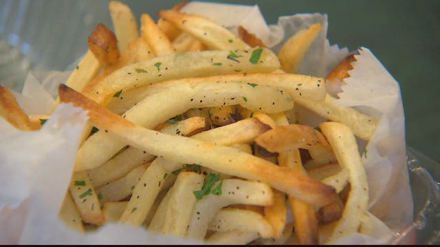 Woman arrested after she allegedly takes french fries from plate of police officer