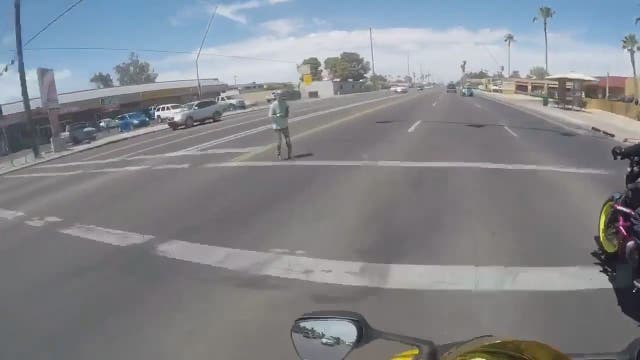 Bikers help woman cross busy street in Phoenix
