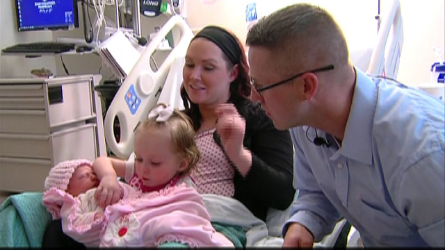 Cop dad delivers his baby daughter on the side of a road