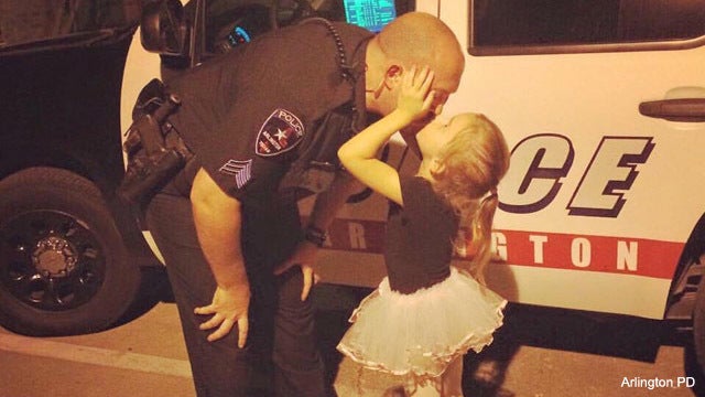Viral Photo: Arlington officer kissed by ballerina daughter