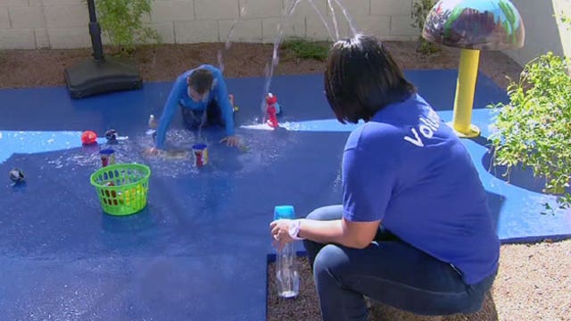 Make A Wish builds splash pad for boy in his backyard