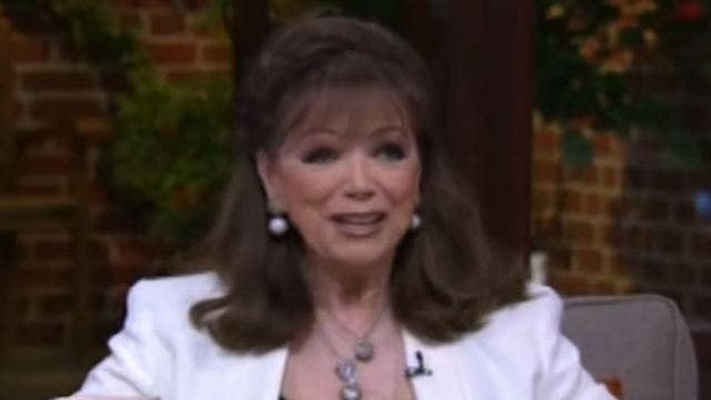 Best-selling novelist Jackie Collins dies of breast cancer at age 77