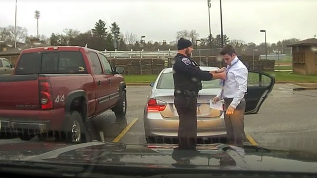 Menomonie police officer helps speeding student tie necktie