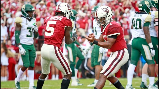 Murray throws for 6 TDs as No. 6 Oklahoma routs Baylor 66-33