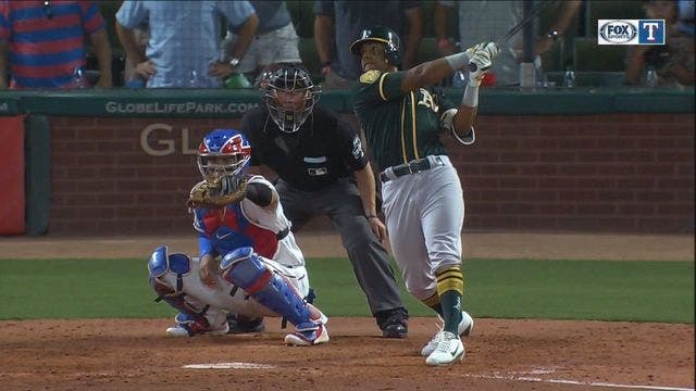 Davis hits 2 more HRs, A's rally again to beat Rangers 6-5
