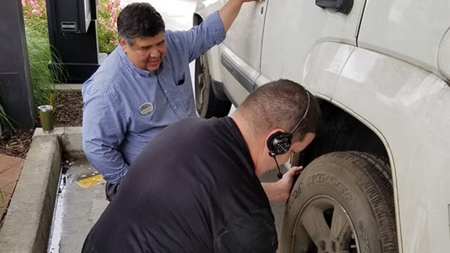 Chick-fil-A employees change customer's flat tire in drive-thru line