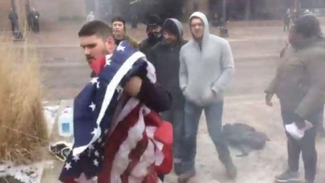 FedEx stands up for driver seen stopping flag-burners