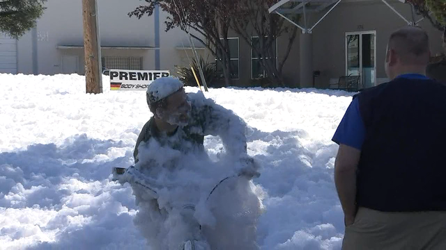 Man rides bike through foam blob and lives to tell the tale