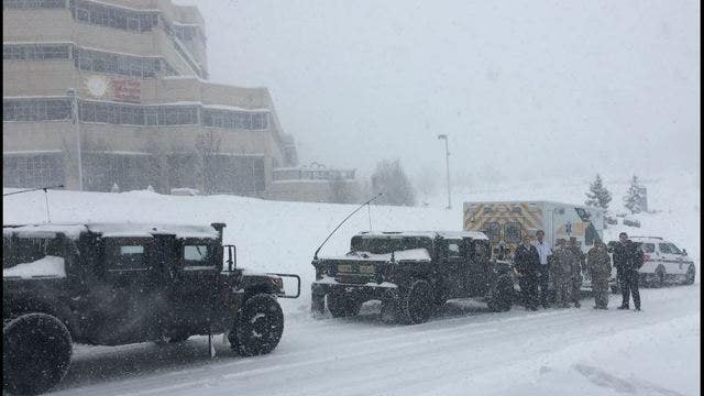 Snowplows escort child needing heart transplant