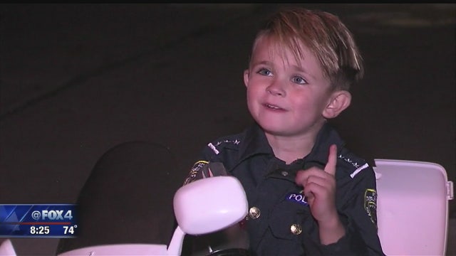 Adorable kid cop patrols his neighborhood streets