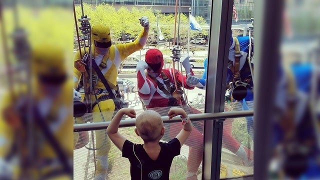 Window washing Power Rangers surprise patients at CHOP