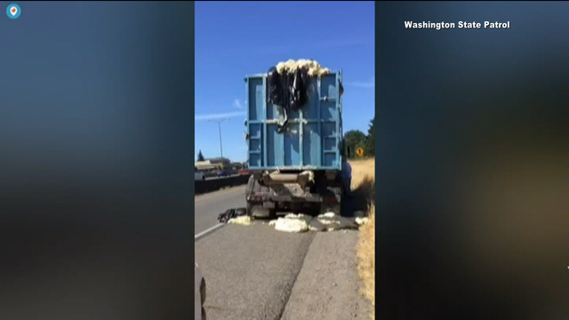 Heat causes dough to rise up out of truck, onto highway