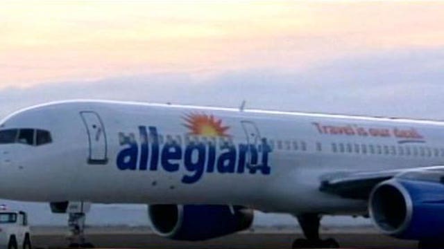 Passengers clap as 7-year-old is escorted off plane during allergy attack