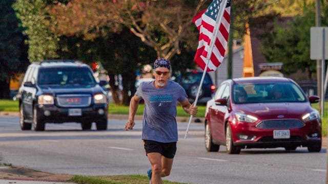Virginia man runs with American flag in hand to honor son, others deployed