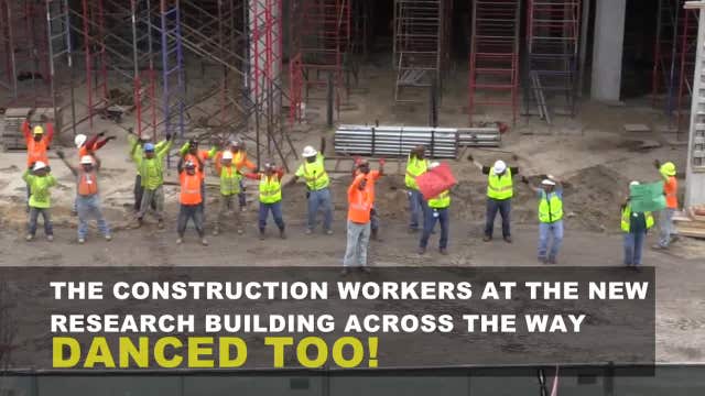WATCH: Construction workers bring huge smiles to tiny patients