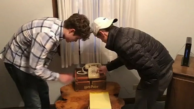 Teens struggle to figure out rotary phone