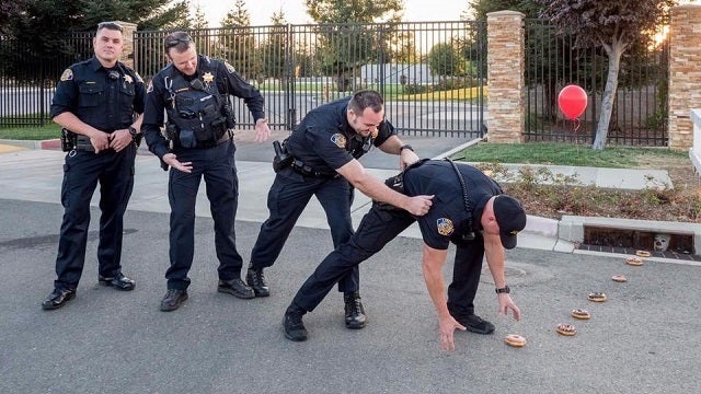 Police officers lured into sewer by donut trail in ‘It'-inspired photo