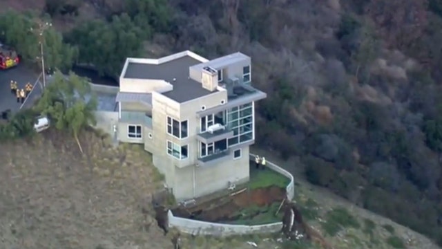 House close to tumbling off cliff in California