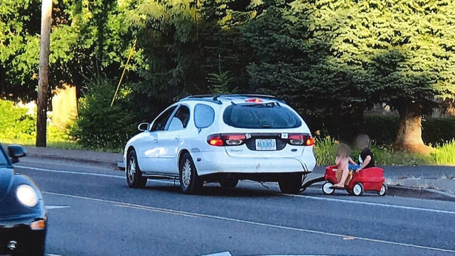 Shocker: Mom arrested after pulling her kids behind her car in a plastic red wagon