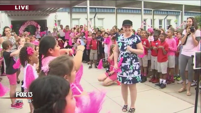 Inspiring pink flash mob welcomes teacher back to school