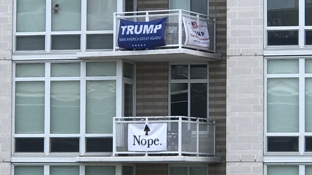 DC apartment building says banners must come down after neighbors' political feud